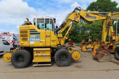 image showing a large yellow on-track machine