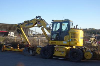 image showing a large yellow on-track machine