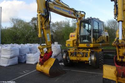image showing a large yellow on-track machine