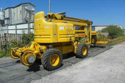 image showing a large yellow on-track machine