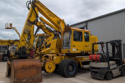 image showing a large yellow on-track machine