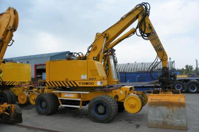 image showing a large yellow on-track machine