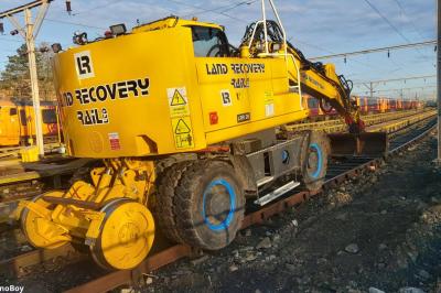 image showing a large yellow on-track machine