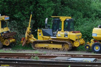 image showing a large yellow on-track machine
