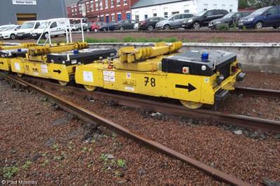 image showing a large yellow on-track machine