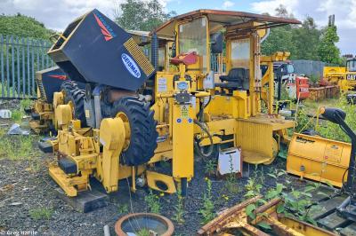 image showing a large yellow on-track machine