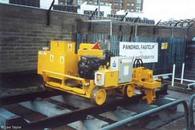 image showing a large yellow on-track machine