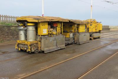 image showing a large yellow on-track machine