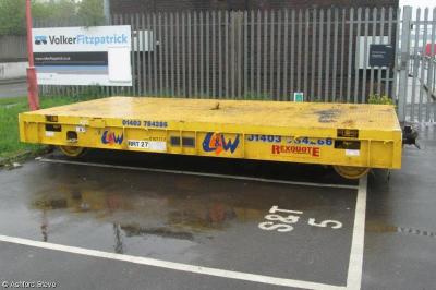 image showing a large yellow on-track machine