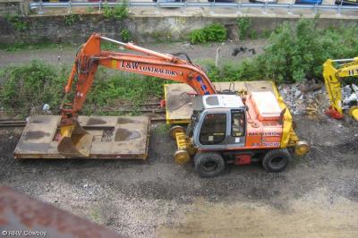 image showing a large yellow on-track machine