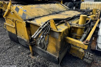 image showing a large yellow on-track machine