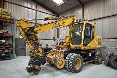 image showing a large yellow on-track machine