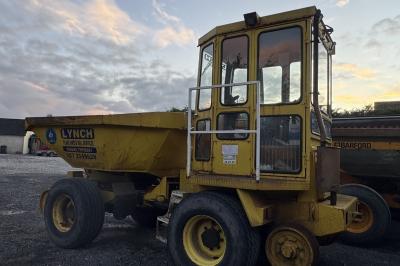 image showing a large yellow on-track machine