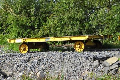 image showing a large yellow on-track machine