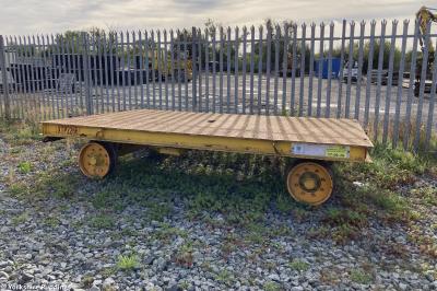 image showing a large yellow on-track machine