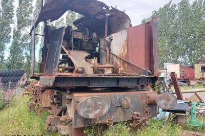 image showing a large yellow on-track machine