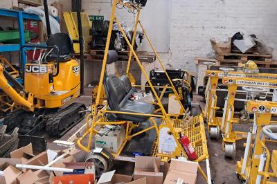 image showing a large yellow on-track machine