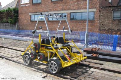 image showing a large yellow on-track machine