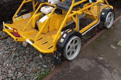 image showing a large yellow on-track machine