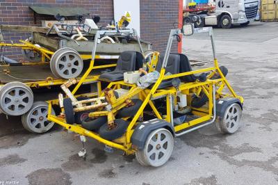 image showing a large yellow on-track machine