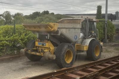 image showing a large yellow on-track machine