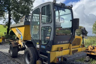 image showing a large yellow on-track machine