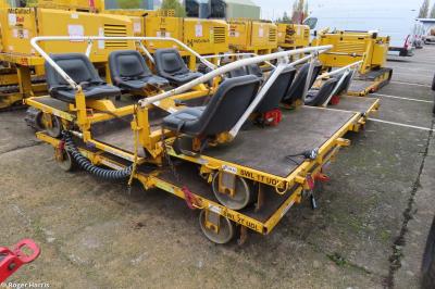 image showing a large yellow on-track machine