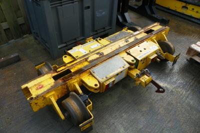 image showing a large yellow on-track machine