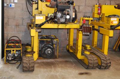 image showing a large yellow on-track machine