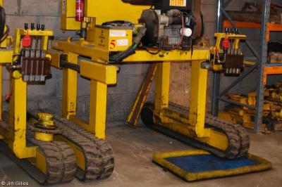 image showing a large yellow on-track machine