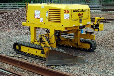 image showing a large yellow on-track machine