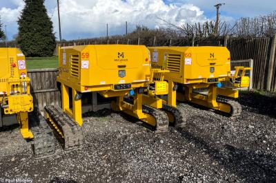 image showing a large yellow on-track machine