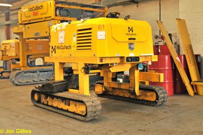 image showing a large yellow on-track machine