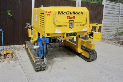 image showing a large yellow on-track machine