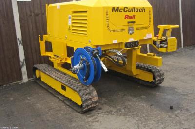 image showing a large yellow on-track machine