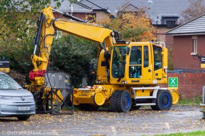 image showing a large yellow on-track machine