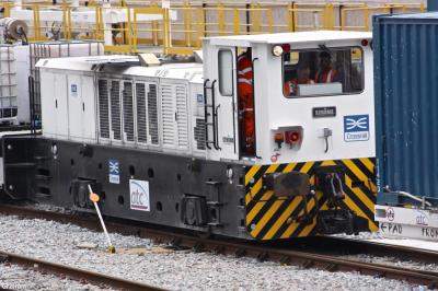 image showing a large yellow on-track machine