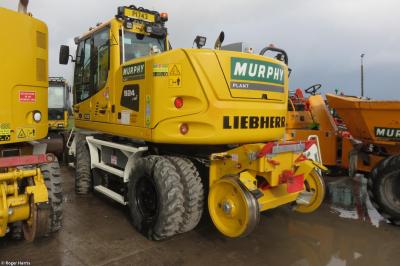 image showing a large yellow on-track machine