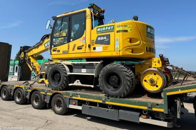 image showing a large yellow on-track machine