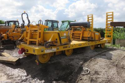 image showing a large yellow on-track machine