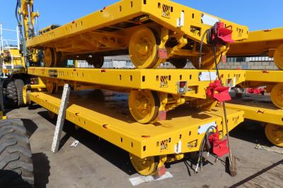 image showing a large yellow on-track machine