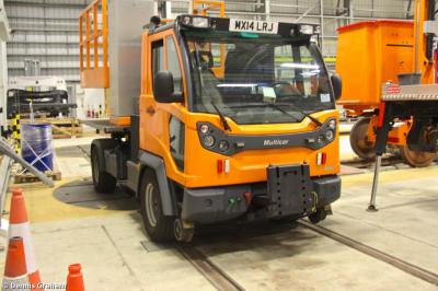 image showing a large yellow on-track machine