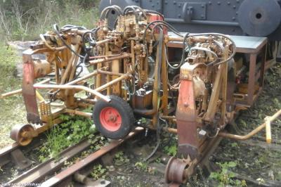 image showing a large yellow on-track machine
