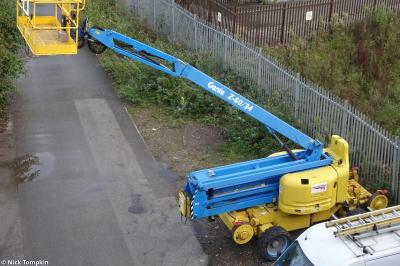 image showing a large yellow on-track machine