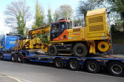image showing a large yellow on-track machine