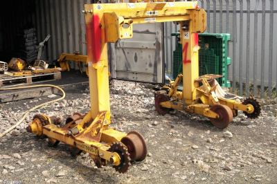 image showing a large yellow on-track machine