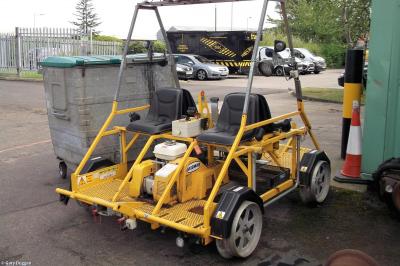 image showing a large yellow on-track machine