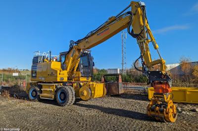 image showing a large yellow on-track machine