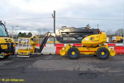 image showing a large yellow on-track machine