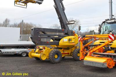 image showing a large yellow on-track machine
